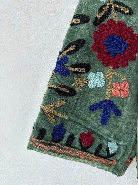 Green Embroidered velvet jacket with colorful patterns & cotton inner lining. perfect for holiday parties or date nights. Artisan made ideal for holiday gifting. Made by artisans in India for Ornate Handicrafts
