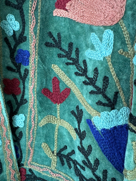 Embroidered velvet jacket with colorful patterns & cotton inner lining. perfect for holiday parties or date nights. Artisan made ideal for holiday gifting. Made by artisans in India for Ornate Handicrafts