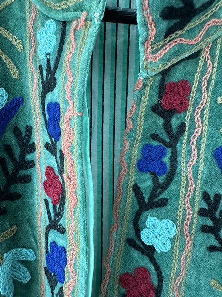Green Embroidered velvet jacket with colorful patterns & cotton inner lining. perfect for holiday parties or date nights. Artisan made ideal for holiday gifting. Made by artisans in India for Ornate Handicrafts