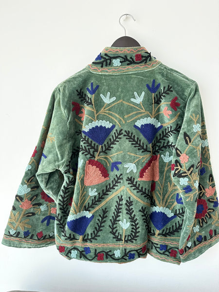 Green Embroidered velvet jacket with colorful patterns & cotton inner lining. perfect for holiday parties or date nights. Artisan made ideal for holiday gifting. Made by artisans in India for Ornate Handicrafts