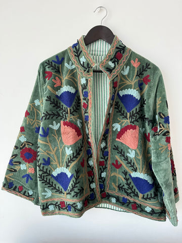 Green Embroidered velvet jacket with colorful patterns & cotton inner lining. perfect for holiday parties or date nights. Artisan made ideal for holiday gifting. Made by artisans in India for Ornate Handicrafts