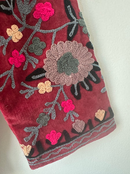 Red embroidered jacket with floral patterns on velvet fabric made by artisans in India for Ornate Handicrafts