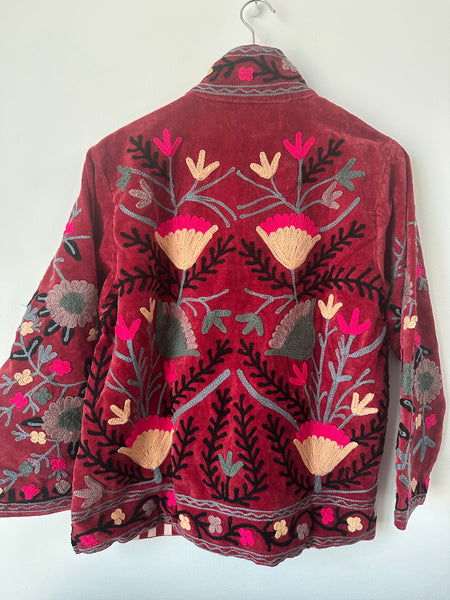 Red embroidered jacket with floral patterns on velvet fabric made by artisans in India for Ornate Handicrafts
