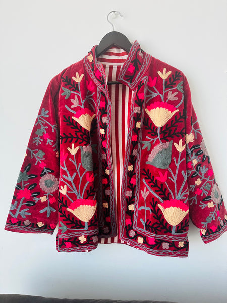 Red embroidered jacket with floral patterns on velvet fabric made by artisans in India for Ornate Handicrafts